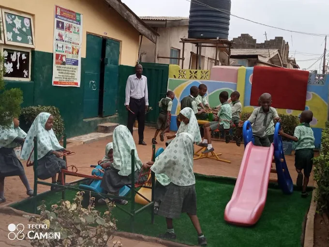 Pupils and staff in the school playground